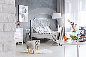 Bedroom with upholstered stools