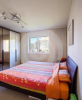 Bedroom with window with blue sky