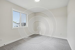 Bedroom with a window and a white wall