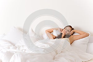 Bedroom - woman waking up and stretching