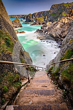 Bedruthan Steps in North Cornwall is a stunning coastline with the waves crashing against the rocks a beautiful landscape