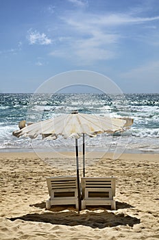 Beds and umbrella on beach