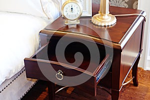 bedside table in bedroom photo