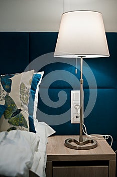 Bedside table lamp in bedroom detail