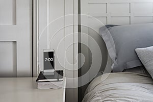 Bedside table phone as alarm