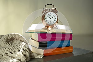 Bedtime reading, alarm clock and books