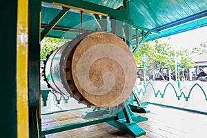 Bedug is large double-barreled drum with water buffalo leather on both sides, has a deeper & duller sound, used among moslim in