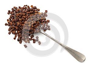 Bee Pollen Propolis On Silver Spoon Isolated