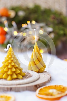 Bee wax candle, shape of fir, Christmas decoration, wooden board