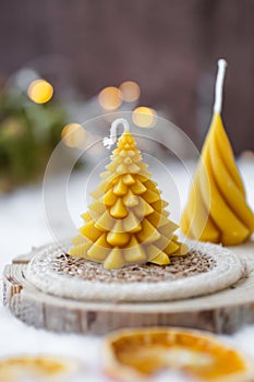 Bee wax candle, shape of fir, Christmas decoration, wooden board