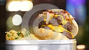 Beef Bacon Cheese Burger With French Fries And Beer - Close Up - Pan - Left To Right