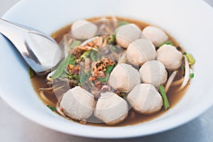 Beef ball soup with bean sprout in a bowl