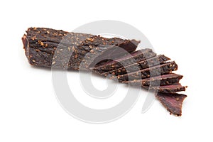 Beef Biltong, South African Beef Jerky isolated on a white studio background.