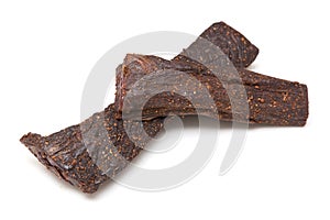 Beef Biltong South African Jerky isolated on a white studio background.