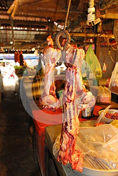 Beef bones hanging in street market