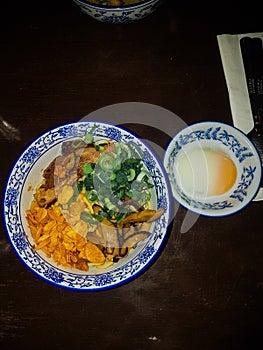 Beef brisket rice bowl with spring onion, garlic, and mushroom photo