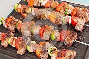 Beef brochette on plancha grill photo
