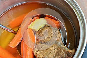 Beef broth in pot closeup