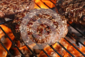 Beef burger for hamburger on barbecue flame grill