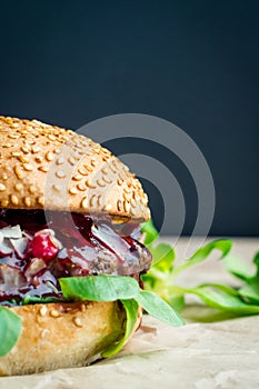 Beef burger with tomato, salad, onion, pepers and cheese