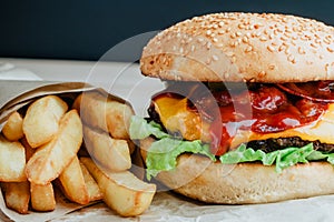 Beef burger with tomato, salad, onion, pepers and cheese