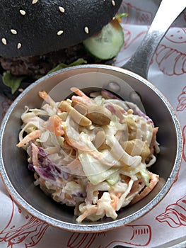 Beef burger and vegetable salad