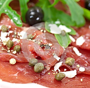 Beef carpaccio with pepper, rucola and parmesan