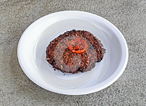 beef chappal kabab served in plate isolated on grey background top view of pakistani and indian spices food