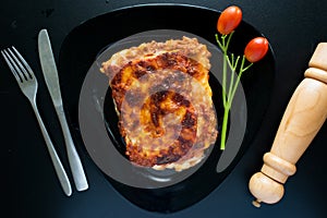 Beef or chicken Lasagnia served in a dish isolated on dark background top view of italian food