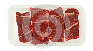 Beef chuck boneless short rib steak on a white foam tray
