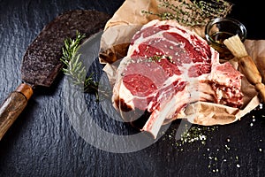 Beef cote de boeuf ribs slice and butcher knife photo