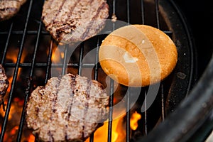 Beef cutlet on grill with bun