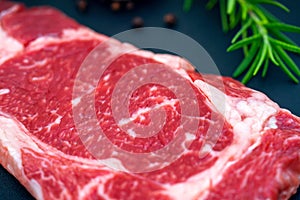 Beef filet mignon steaks, Wagyu fillet steak with rosemary, pepper on dark background