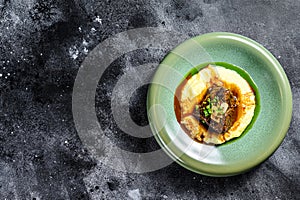 Beef fillet steak with mashed potatoes. Black background. Top view. Copy space