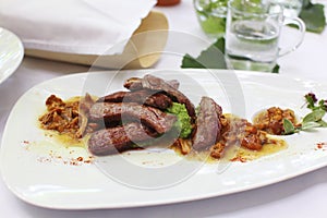 Beef fillet tagliata with wild mushrooms