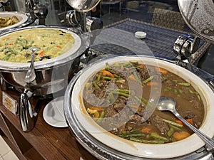 Beef goulash or meat stew inside a chafing dish at the restaurant.