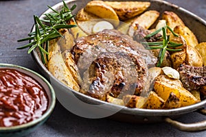 Beef grilled steaks with barbecue sauce roasted potatoes and rosemary