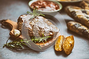 Beef grilled steaks with barbecue sauce roasted potatoes and rosemary