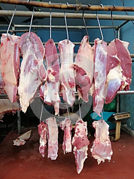 Beef hanging in a butcher shop