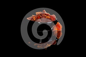 Beef jerky on black.