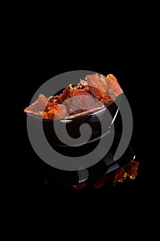 Beef jerky on black.