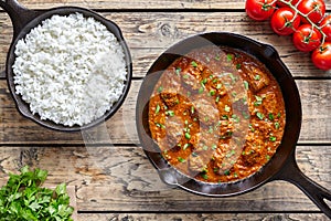 Beef Madras curry slow cook Indian spicy garam masala lamb food in cast iron pan