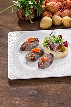 Beef Meat Balls or Rissole with mashed potato on wooden table