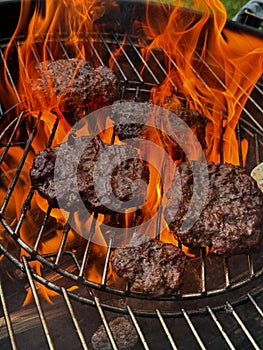 Beef meat barbecue burgers prepared on bbq fire flame