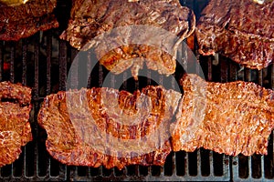 Beef meat barbecue grilled with embers and smoke