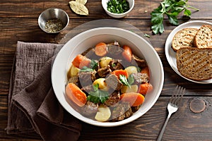 Beef meat stewed with potatoes, carrots and spices