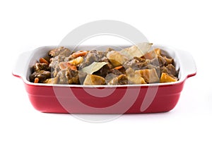 Beef meat stewed with potatoes, carrots and spices in ceramic pot isolated