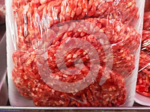 Beef mince in food packaging and film for sale in a meat shop