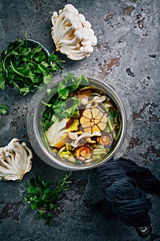 Beef and miso garlic broth, soup with vegetables, mushrooms and cilantro