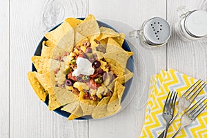 Beef nachos with jalapeno, olives, tomato, beans cheddar cheese